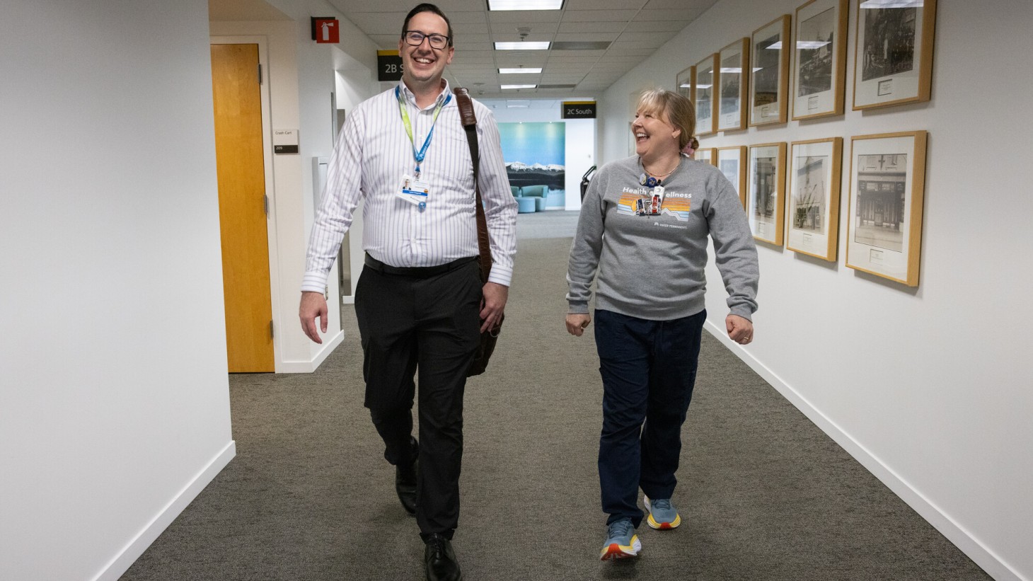 A man and woman walking and smiling